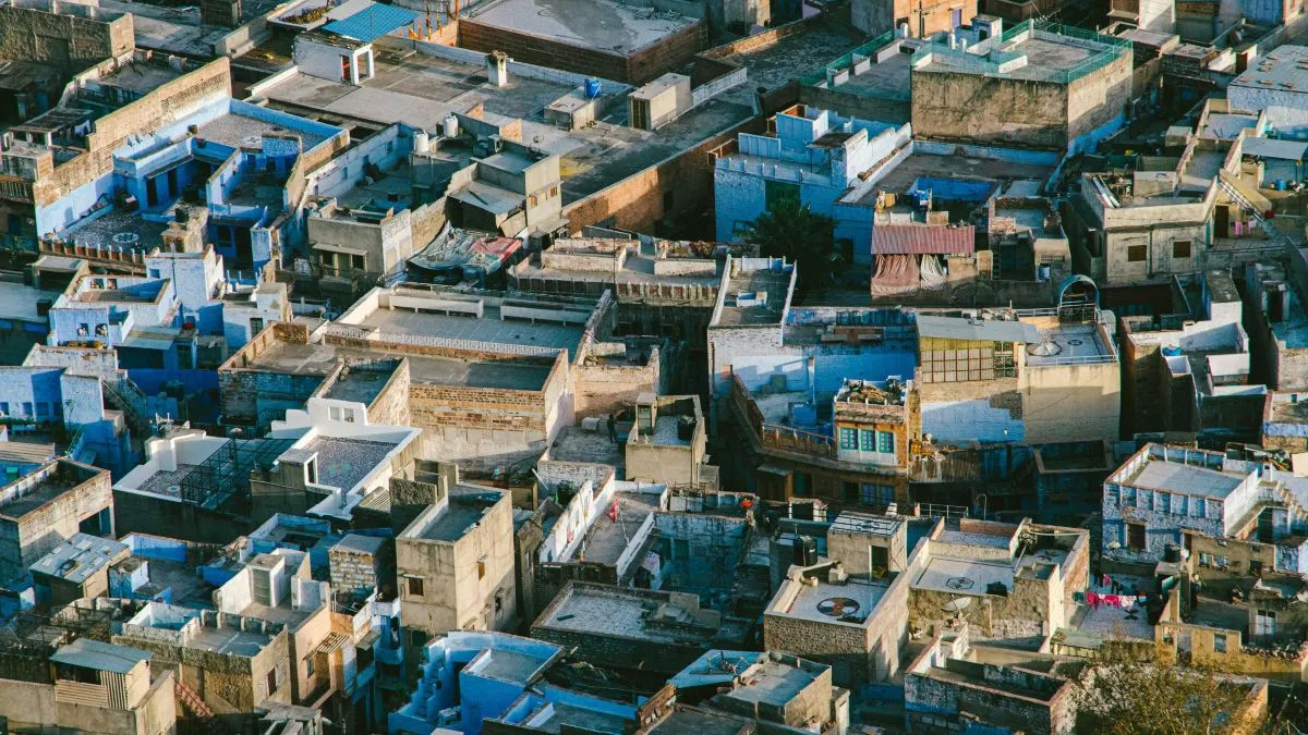 Aerial view of Jodhpur showcasing its iconic blue buildings under a clear sky.